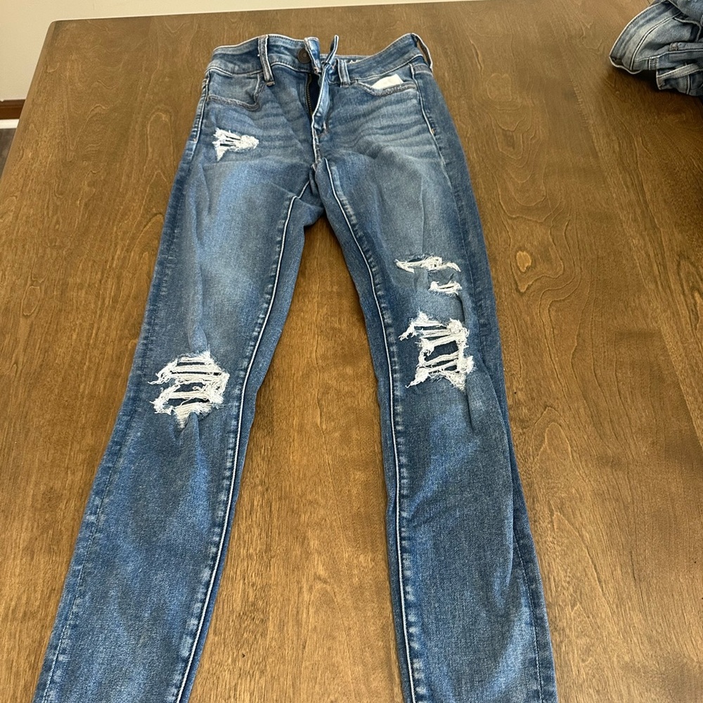 American Eagle, dark wash‎ with jeans covered holes